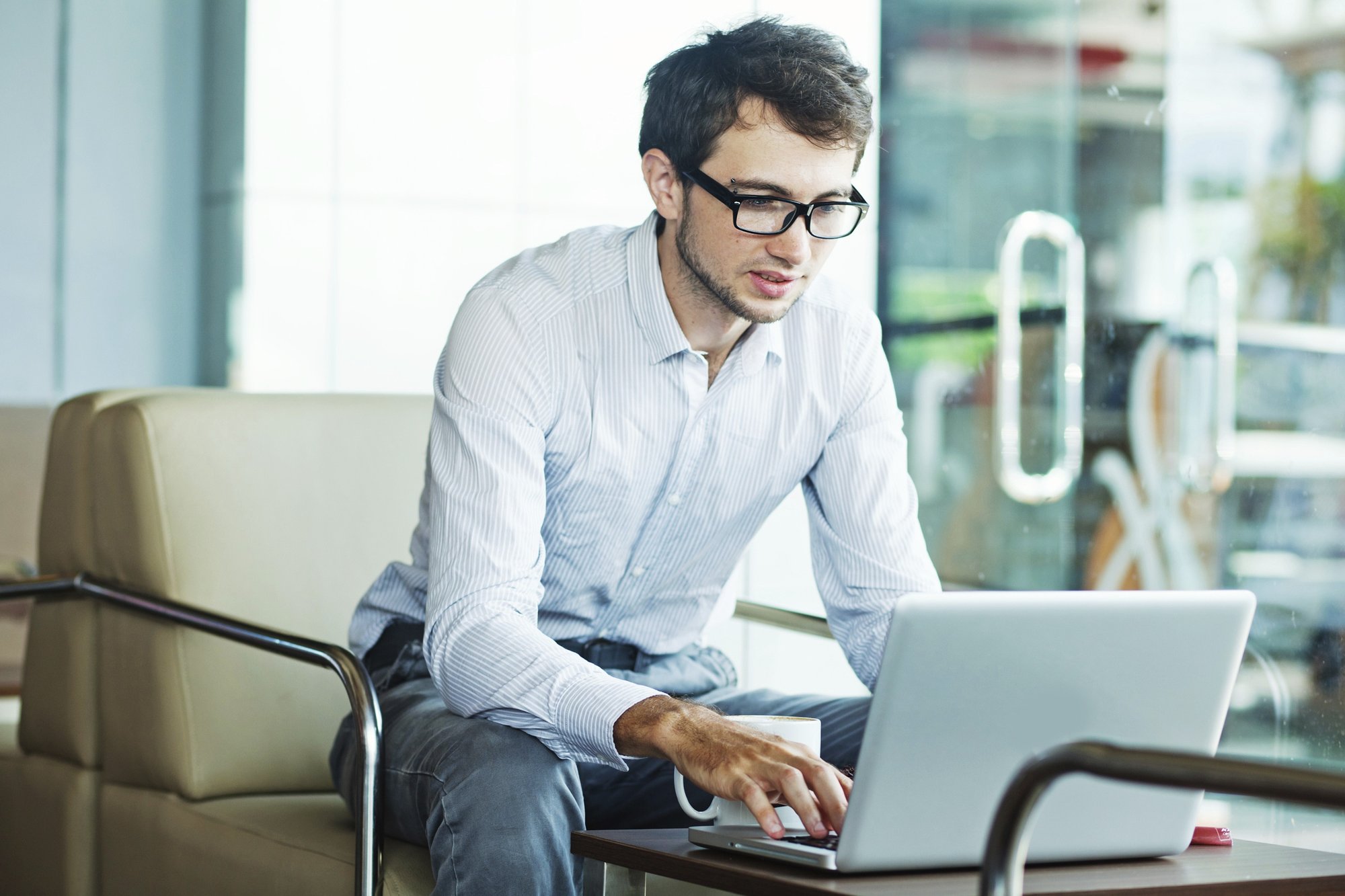 young professional looking at his computer