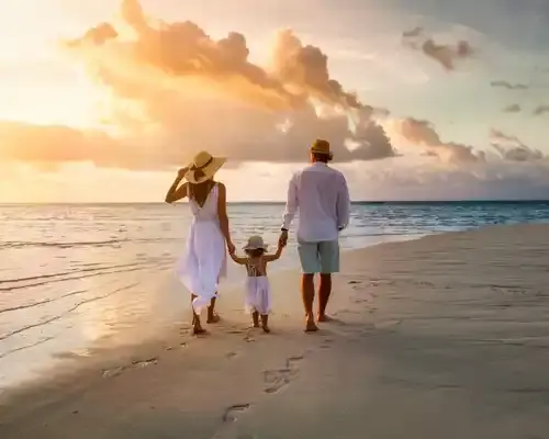 travel-insurance-for-a-elegant-family-in-white-summer-clothing-walks-hand-in