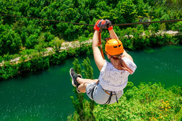 women-enjoying-a-thrilling-zipline-experience--embracing-the-exhilaration-of