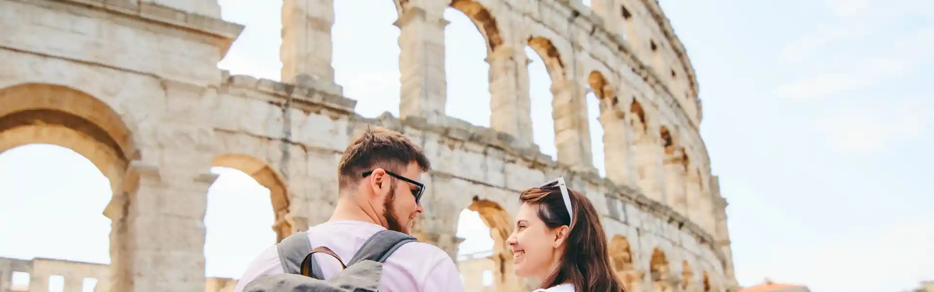 happy-beautiful-couple-in-front-of-coliseum-in-pula-croatia